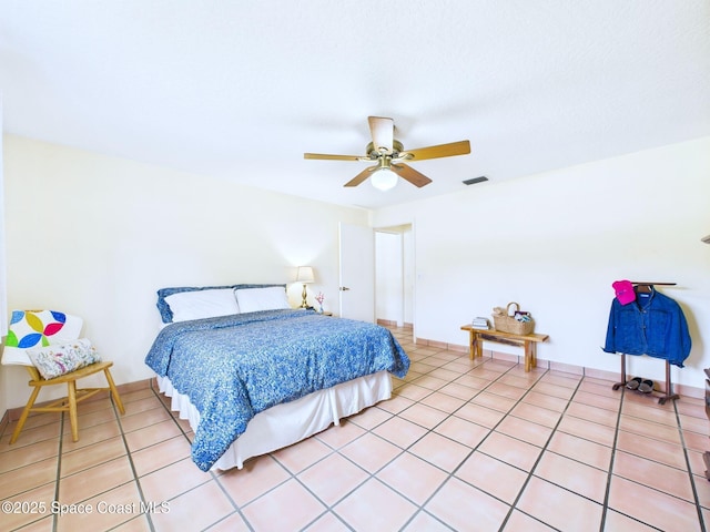 3200 Grant Rd, Grant-Valkaria, FL 32949 - bedroom featuring light tile patterned flooring and ceiling fan