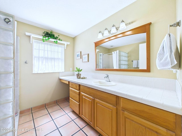 3200 Grant Rd, Grant-Valkaria, FL 32949 - full bathroom featuring vanity, walk in shower, and tile patterned floors