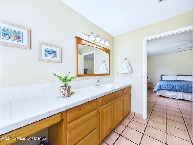 3200 Grant Rd, Grant-Valkaria, FL 32949 - ensuite bathroom featuring vanity and tile patterned floors