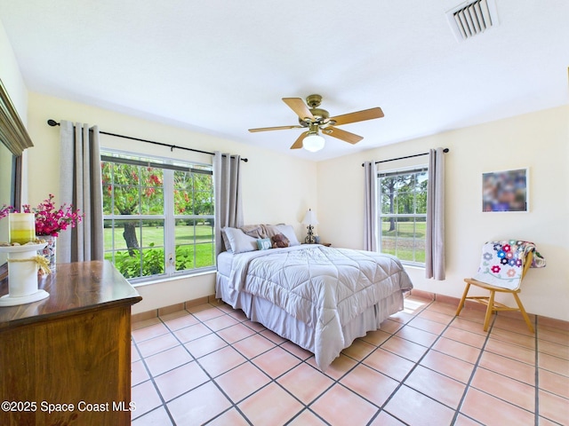 3200 Grant Rd, Grant-Valkaria, FL 32949 - bedroom featuring light tile patterned flooring and a ceiling fan
