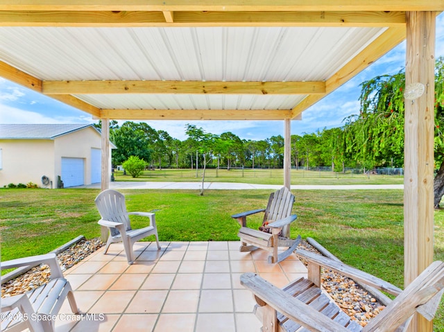 3200 Grant Rd, Grant-Valkaria, FL 32949 - view of patio / terrace with a garage and view of wooded area