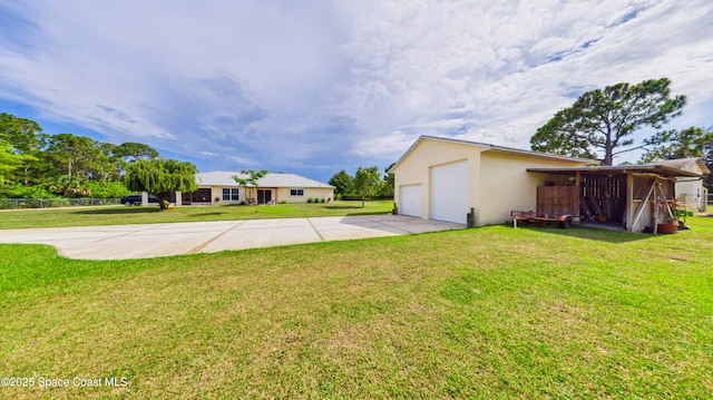 3200 Grant Rd, Grant-Valkaria, FL 32949 - view of green lawn with a detached garage and an outdoor structure