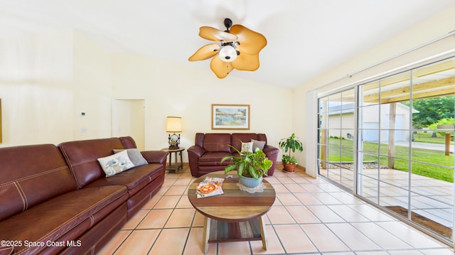 3200 Grant Rd, Grant-Valkaria, FL 32949 - living area featuring vaulted ceiling, a ceiling fan, and light tile patterned floors