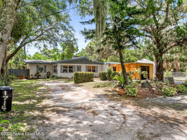 1714 Blanche Ave, Melbourne, FL 32934 - back of house with dirt driveway