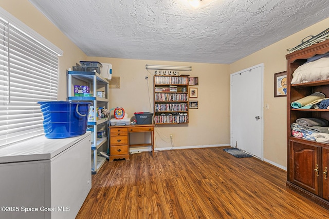 1714 Blanche Ave, Melbourne, FL 32934 - office area with wood finished floors and a textured ceiling