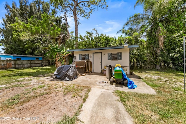 1714 Blanche Ave, Melbourne, FL 32934 - back of house with stucco siding and a patio