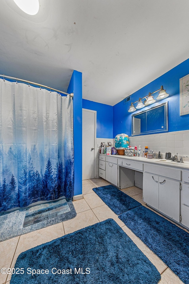 1714 Blanche Ave, Melbourne, FL 32934 - full bathroom featuring vanity, tile patterned floors, and a shower with curtain
