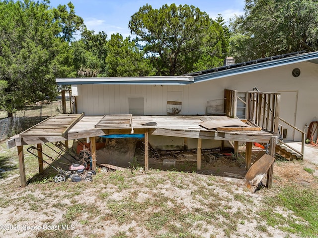 1714 Blanche Ave, Melbourne, FL 32934 - rear view of house with a wooden deck
