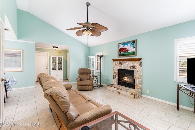 3461 Cove Ct, Melbourne, FL 32935 - tiled living room with ceiling fan, a fireplace, and high vaulted ceiling