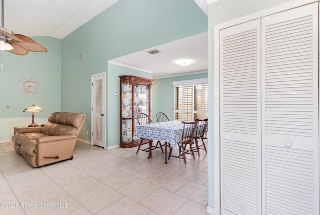 3461 Cove Ct, Melbourne, FL 32935 - dining space with high vaulted ceiling, ceiling fan, and light tile patterned flooring
