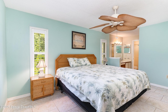 3461 Cove Ct, Melbourne, FL 32935 - bedroom featuring light tile patterned floors, ensuite bath, and a ceiling fan