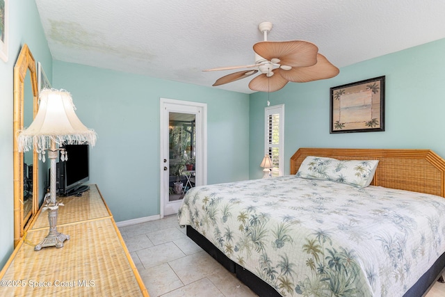 3461 Cove Ct, Melbourne, FL 32935 - bedroom featuring light tile patterned floors and a ceiling fan