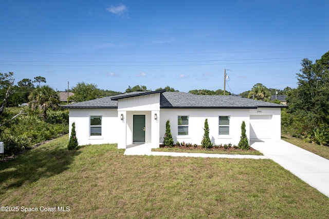 2943 Creech Ave SE, Palm Bay, FL 32909 - view of front of house with concrete driveway, a front lawn, a garage, a shingled roof, and stucco siding