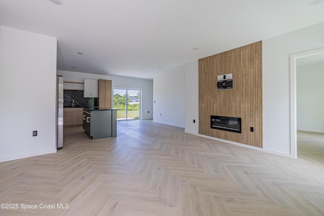 2943 Creech Ave SE, Palm Bay, FL 32909 - unfurnished living room with baseboards and a fireplace