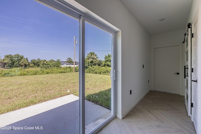 2943 Creech Ave SE, Palm Bay, FL 32909 - entryway featuring baseboards and a barn door