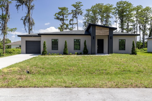 1326 Sagbloom St SE, Palm Bay, FL 32909 - view of front facade featuring driveway, stucco siding, an attached garage, and a front lawn