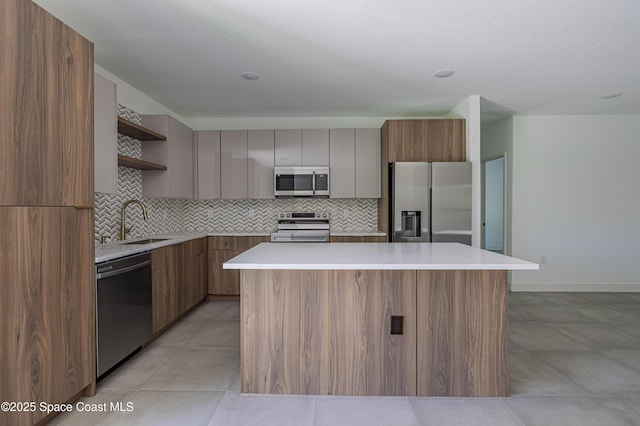 1326 Sagbloom St SE, Palm Bay, FL 32909 - kitchen featuring stainless steel appliances, open shelves, modern cabinets, and tasteful backsplash
