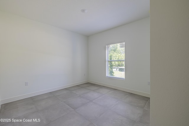 1326 Sagbloom St SE, Palm Bay, FL 32909 - unfurnished room featuring baseboards and concrete floors