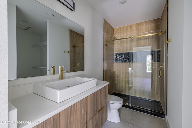 1326 Sagbloom St SE, Palm Bay, FL 32909 - bathroom featuring a shower stall, vanity, and tile patterned floors