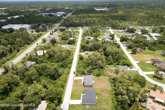 1326 Sagbloom St SE, Palm Bay, FL 32909 - aerial overview of property's location featuring nearby suburban area and a forest