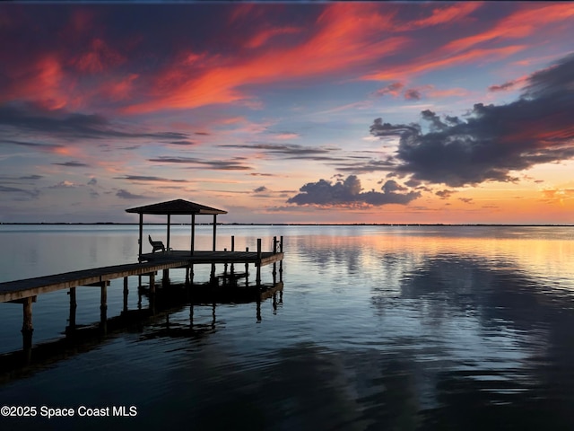 2880 S Atlantic Ave Unit 102, Cocoa Beach, FL 32931 - dock area featuring a water view and boat lift