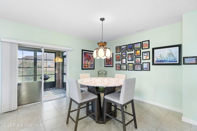 3724 Sandhill Crane Cir, Mims, FL 32754 - dining room featuring baseboards and light tile patterned floors