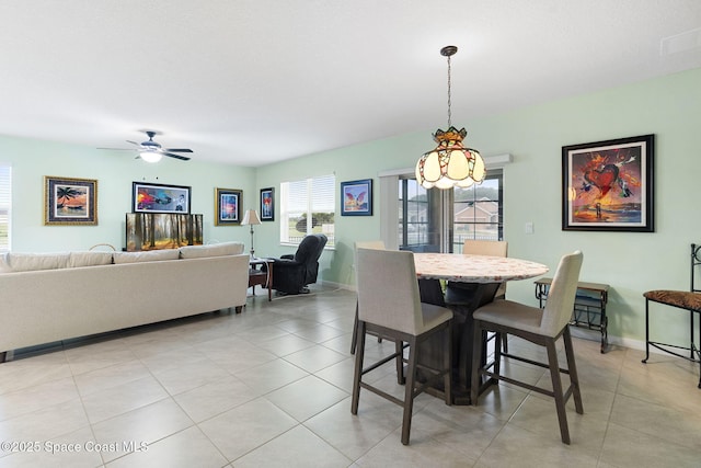 3724 Sandhill Crane Cir, Mims, FL 32754 - dining area with light tile patterned floors and a ceiling fan