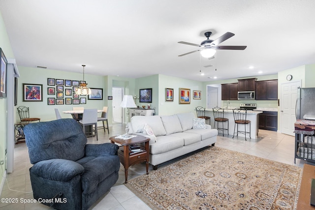 3724 Sandhill Crane Cir, Mims, FL 32754 - living area featuring light tile patterned flooring, ceiling fan, and recessed lighting