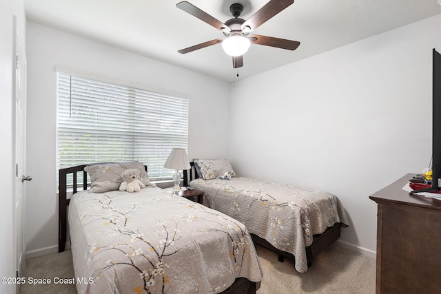 3724 Sandhill Crane Cir, Mims, FL 32754 - carpeted bedroom with baseboards and ceiling fan