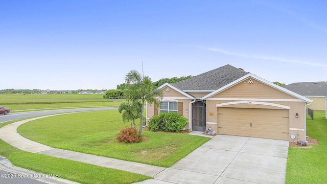 3724 Sandhill Crane Cir, Mims, FL 32754 - view of front facade featuring concrete driveway, a front lawn, an attached garage, and stucco siding