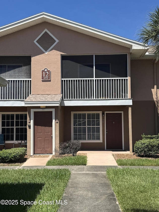 1870 Long Iron Dr Unit 1225, Rockledge, FL 32955 - view of front of property with stucco siding and a balcony