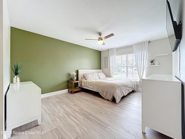 1870 Long Iron Dr Unit 1225, Rockledge, FL 32955 - bedroom featuring light wood-style flooring and ceiling fan