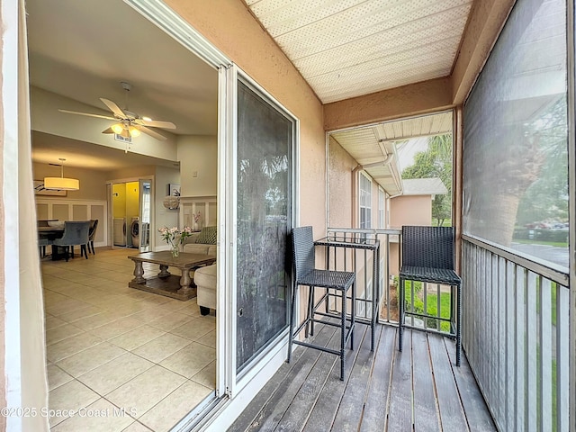 1870 Long Iron Dr Unit 1225, Rockledge, FL 32955 - sunroom / solarium with a ceiling fan and washing machine and dryer