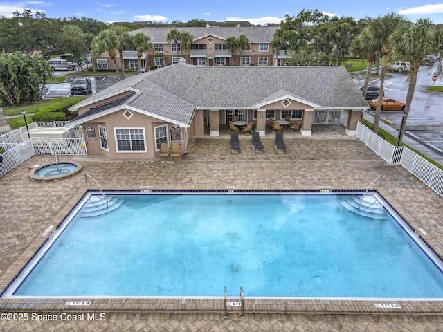 1870 Long Iron Dr Unit 1225, Rockledge, FL 32955 - community pool with a community hot tub, a fenced backyard, and a patio area