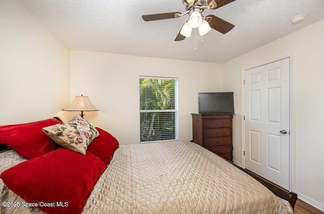 793 Ontario St NW, Palm Bay, FL 32907 - bedroom with wood finished floors, a textured ceiling, and ceiling fan