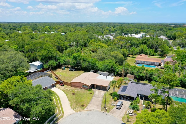614 W Ct, Titusville, FL 32796 - bird's eye view of a forest and a pool area