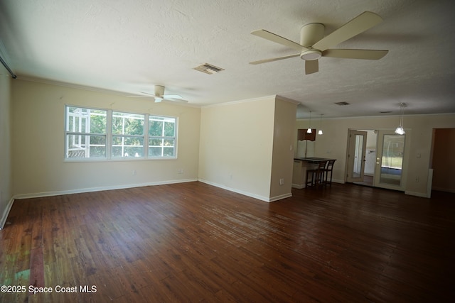 614 W Ct, Titusville, FL 32796 - unfurnished room featuring a ceiling fan, a textured ceiling, wood finished floors, and ornamental molding