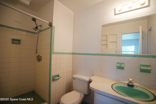 614 W Ct, Titusville, FL 32796 - bathroom with tiled shower, vanity, a wainscoted wall, and tile walls