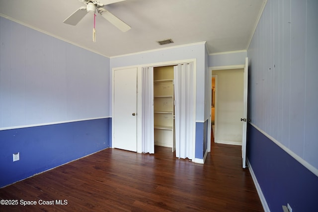 614 W Ct, Titusville, FL 32796 - unfurnished bedroom with crown molding, wood finished floors, a closet, and ceiling fan