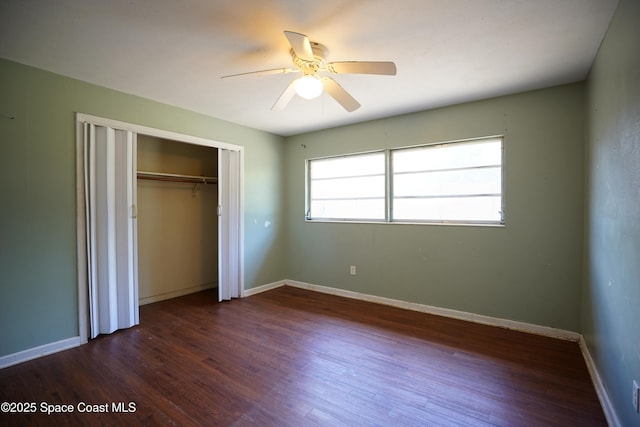 614 W Ct, Titusville, FL 32796 - unfurnished bedroom featuring dark wood-type flooring, a closet, and ceiling fan