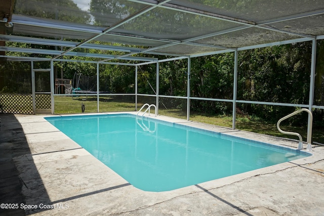 614 W Ct, Titusville, FL 32796 - outdoor pool featuring a patio, a lanai, and a yard
