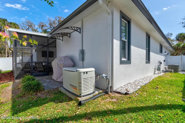 105 Azalea Cir, New Smyrna Beach, FL 32168 - view of side of property featuring stucco siding, a sunroom, and a patio