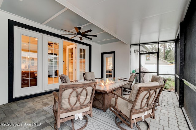 105 Azalea Cir, New Smyrna Beach, FL 32168 - sunroom with french doors, an outdoor fire pit, and a ceiling fan
