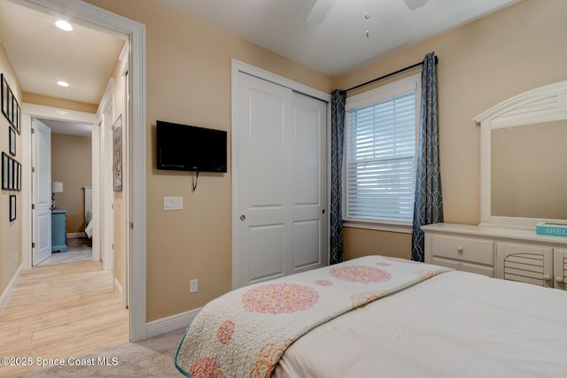105 Azalea Cir, New Smyrna Beach, FL 32168 - bedroom with a closet, recessed lighting, a ceiling fan, and light wood-style flooring