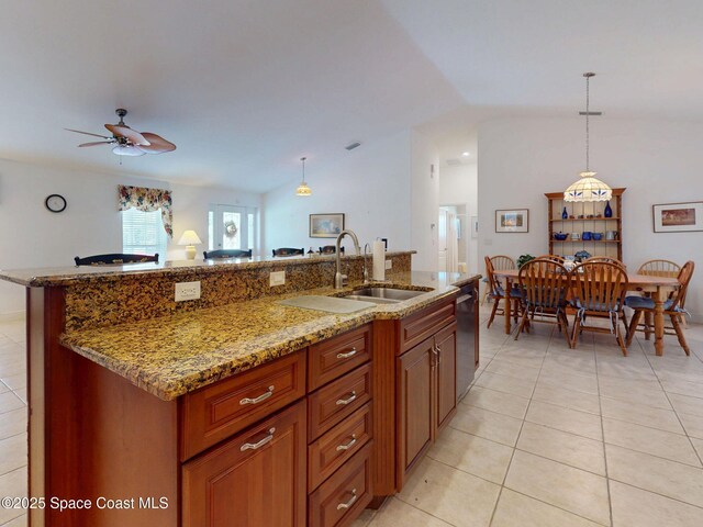 6025 Brabrook Ave, Grant, FL 32949 - kitchen with dishwasher, light tile patterned flooring, ceiling fan, and light stone countertops