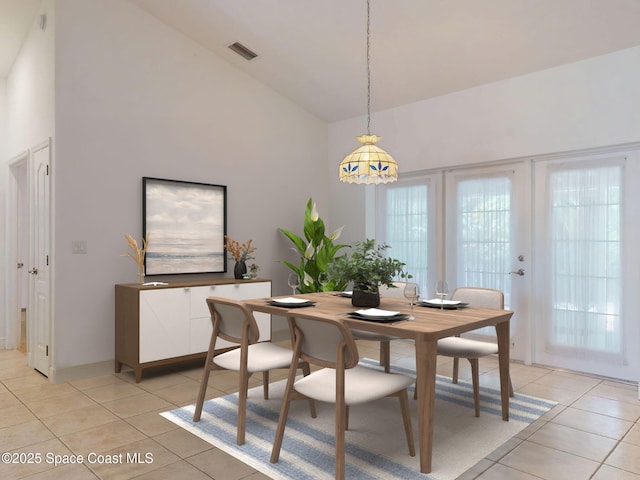 6025 Brabrook Ave, Grant, FL 32949 - dining area featuring light tile patterned floors and high vaulted ceiling