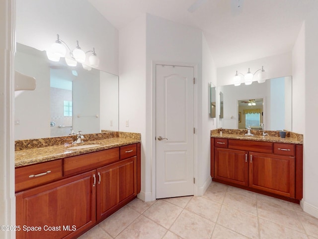 6025 Brabrook Ave, Grant, FL 32949 - full bath with a ceiling fan, two vanities, and tile patterned flooring