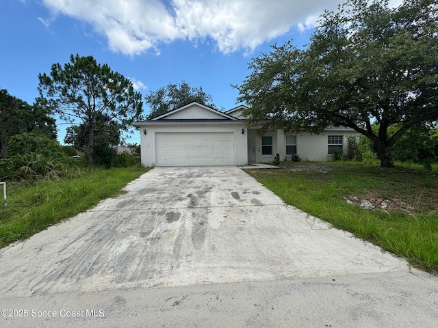 961 Culpepper Ave SE, Palm Bay, FL 32909 - ranch-style house featuring stucco siding, a garage, and concrete driveway