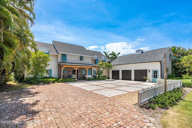 2600 N Riverside Dr, Indialantic, FL 32903 - view of front facade featuring decorative driveway, an attached garage, and roof with shingles