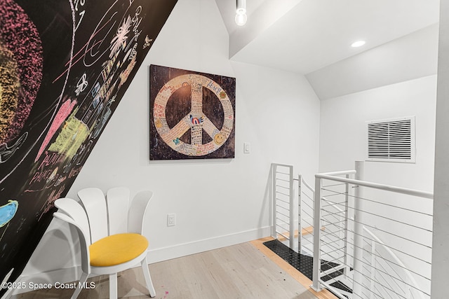 2600 N Riverside Dr, Indialantic, FL 32903 - living area with an upstairs landing, wood finished floors, lofted ceiling, and recessed lighting